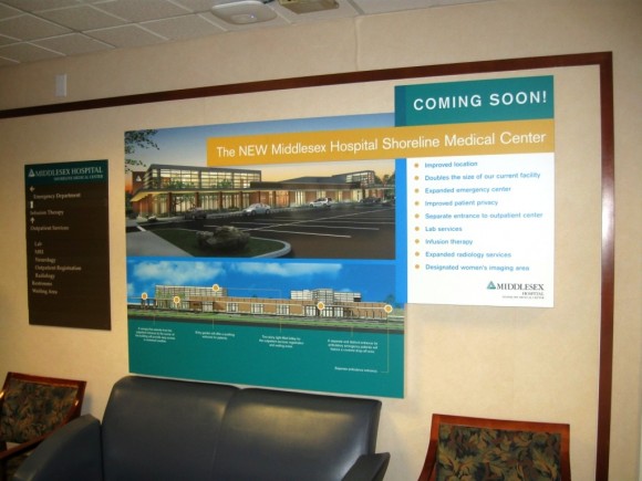 Wall poster in the Essex Medical Center showing its future center in Westbrook
