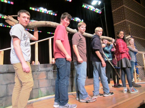Valley Regional Musical Productions cast and crew members help move a tree limb to be used to construct the set for the production of THE SECRET GARDEN on March 14-16 at Valley Regional High School. (from l-r):  Greg Magruder,  Zach Crosby, Dan Leffingwell, Michael Leffingwell, Madison Estelle, Eryn Star, Olivia Wilkinson and Charlotte Boland. 