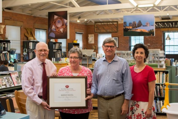 Essex Historical Society President Sherry Clark, left, and Director Melissa Josefiak GIVE Preservation Award to Centerbrook. 