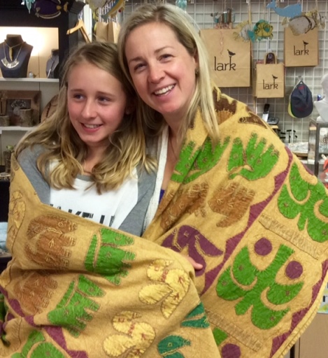 Kate and Anne Yurasek wrap themselves up in a cozy quilt at Lark.